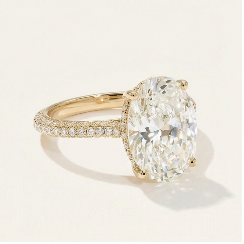 The Sophia oval cut lab-grown diamond solitaire engagement ring in 14K yellow gold with pave band from multiple angles