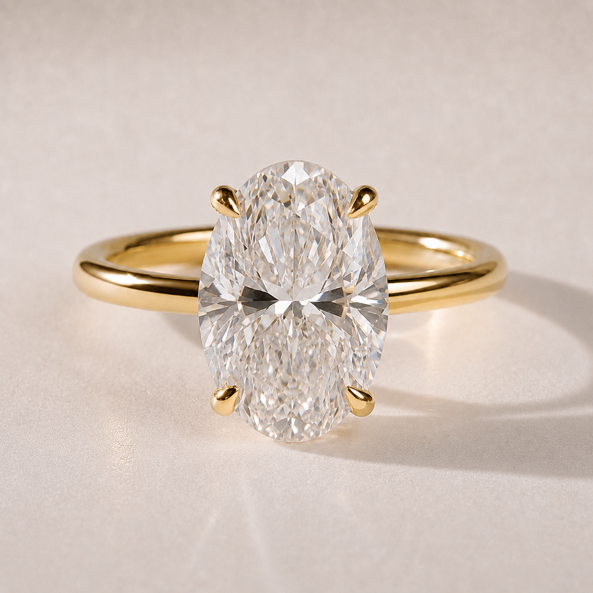 The Colette oval lab-grown diamond hidden halo engagement ring in 14K yellow gold