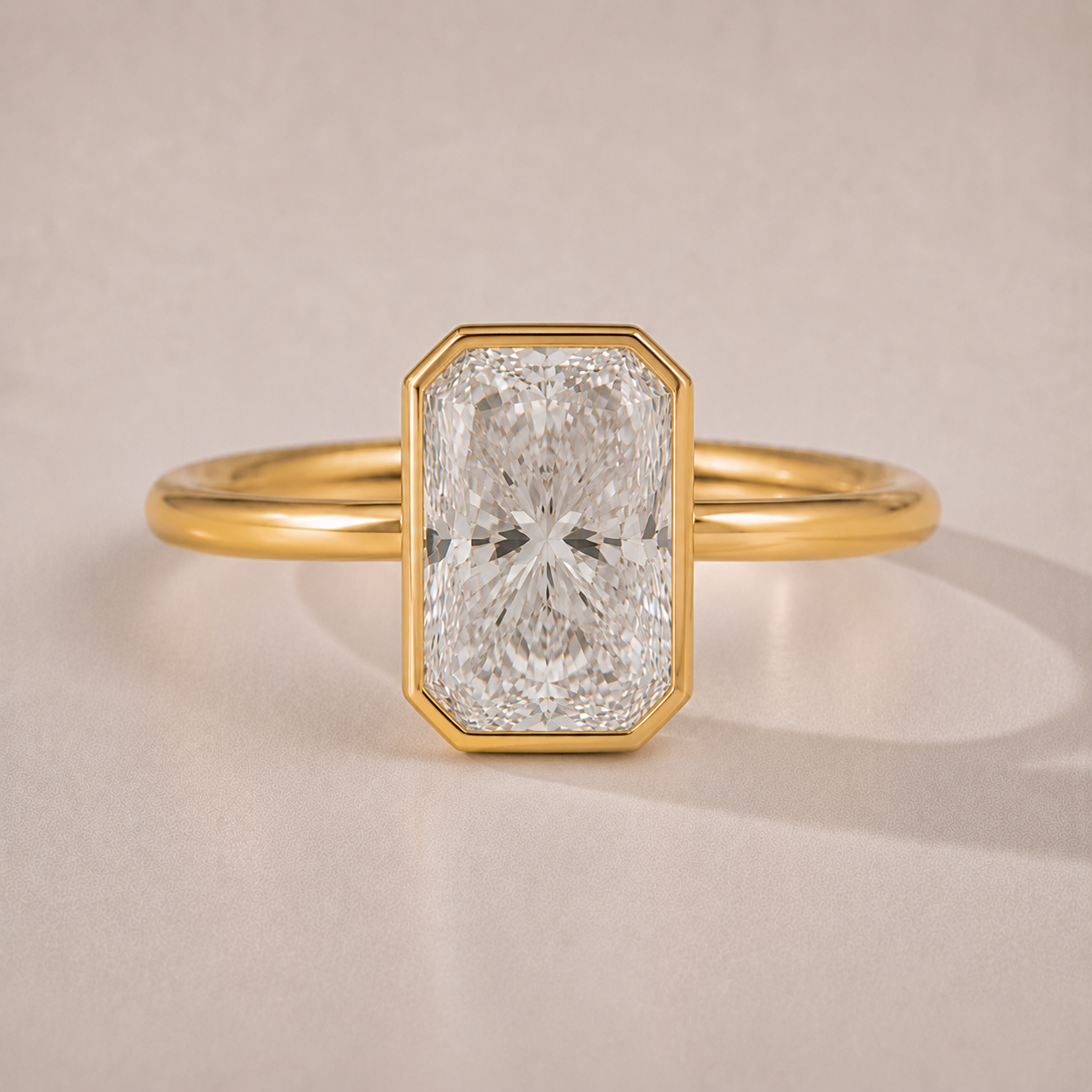 The Margaux — radiant-cut bezel-set lab-grown diamond engagement ring in 14K yellow gold