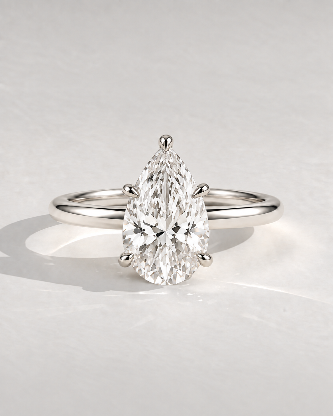 The Lucienne — Pear Solitaire Engagement Ring — illustrative design render