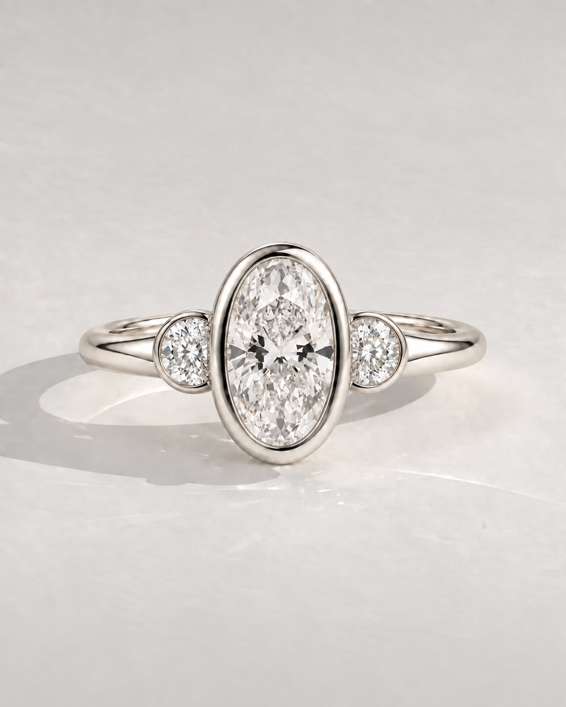 Roselle Oval Bezel Three-Stone in 14k white gold — design visualization
