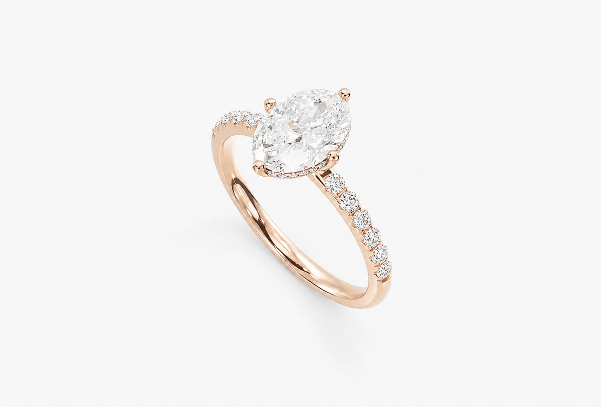 Oval hidden halo lab-grown diamond engagement ring, 14k Rose Gold, angled view, 3D render
