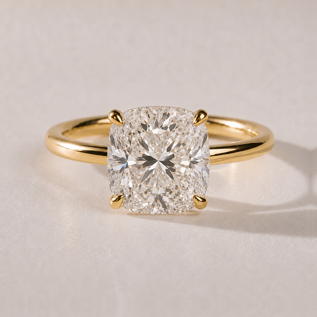 The Amalie — cushion-cut lab-grown diamond solitaire engagement ring in 14K yellow gold