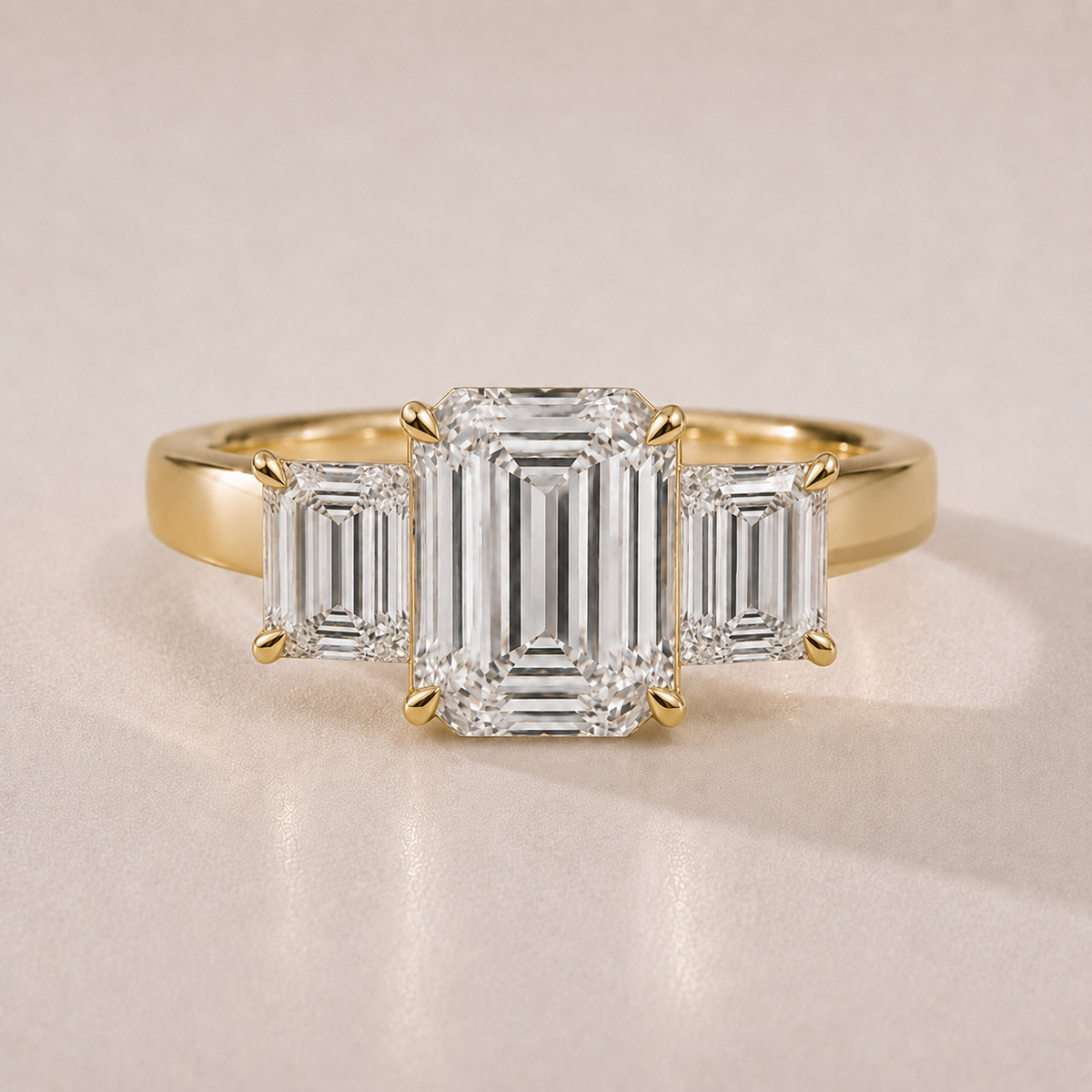 The Beatrix — three emerald-cut lab-grown diamond engagement ring in 14K yellow gold