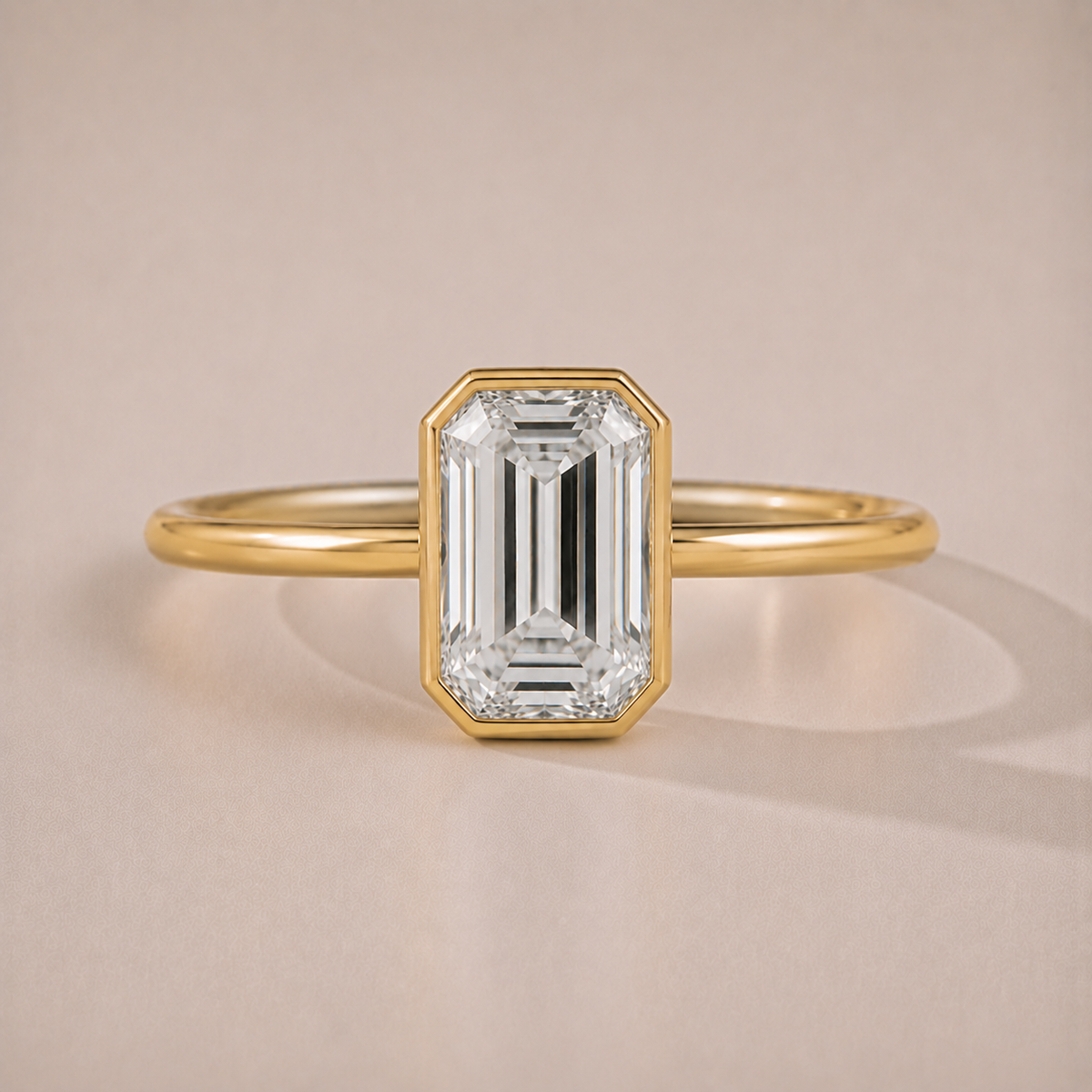 The Bettina — emerald-cut full-bezel lab-grown diamond engagement ring in 14K yellow gold