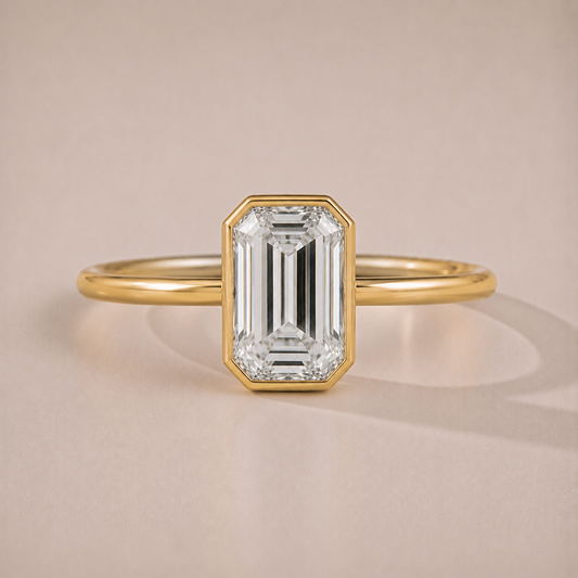 The Bettina — emerald-cut full-bezel lab-grown diamond engagement ring in 14K yellow gold