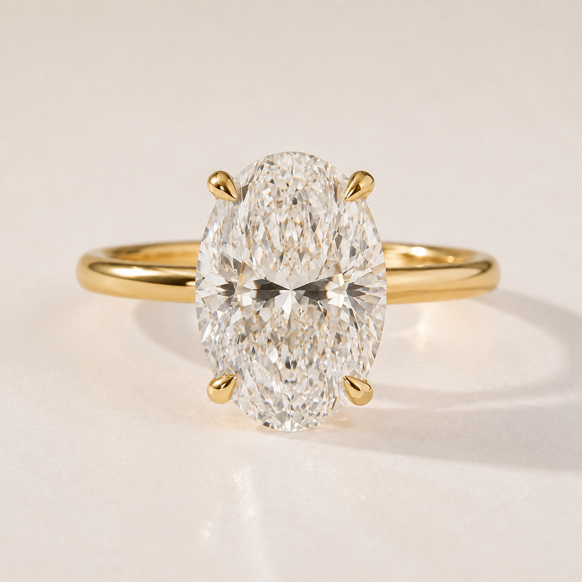 The Francesca — four-carat oval lab-grown diamond solitaire engagement ring in 14K yellow gold