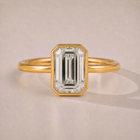 The Ines — emerald-cut bezel-set lab-grown diamond engagement ring in 14K yellow gold