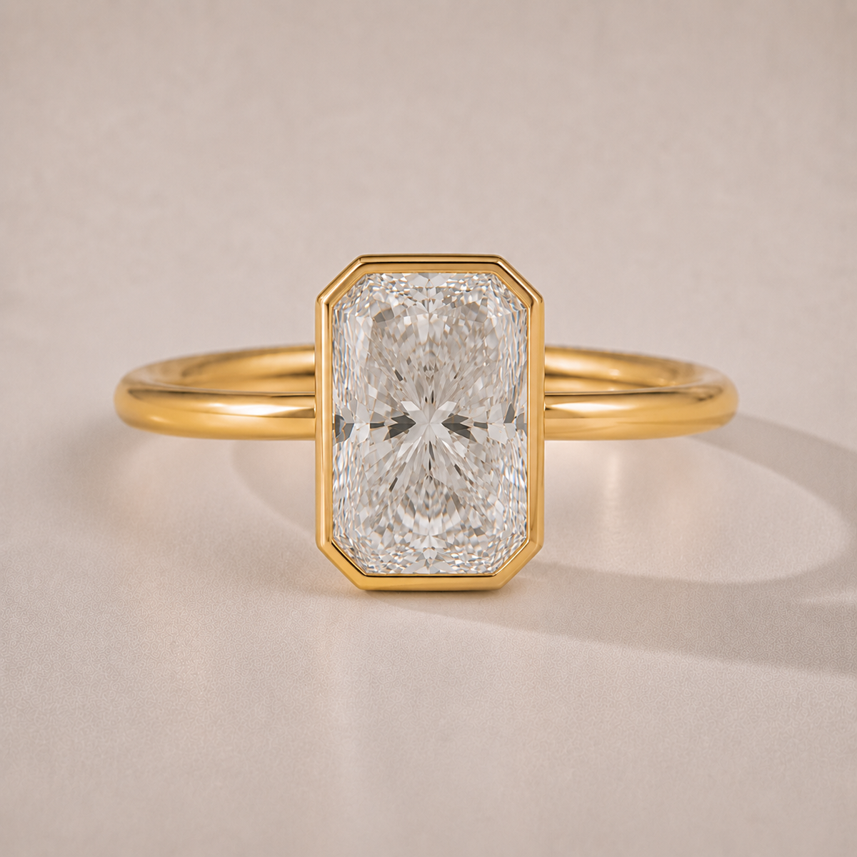 The Margaux — radiant-cut bezel-set lab-grown diamond engagement ring in 14K yellow gold